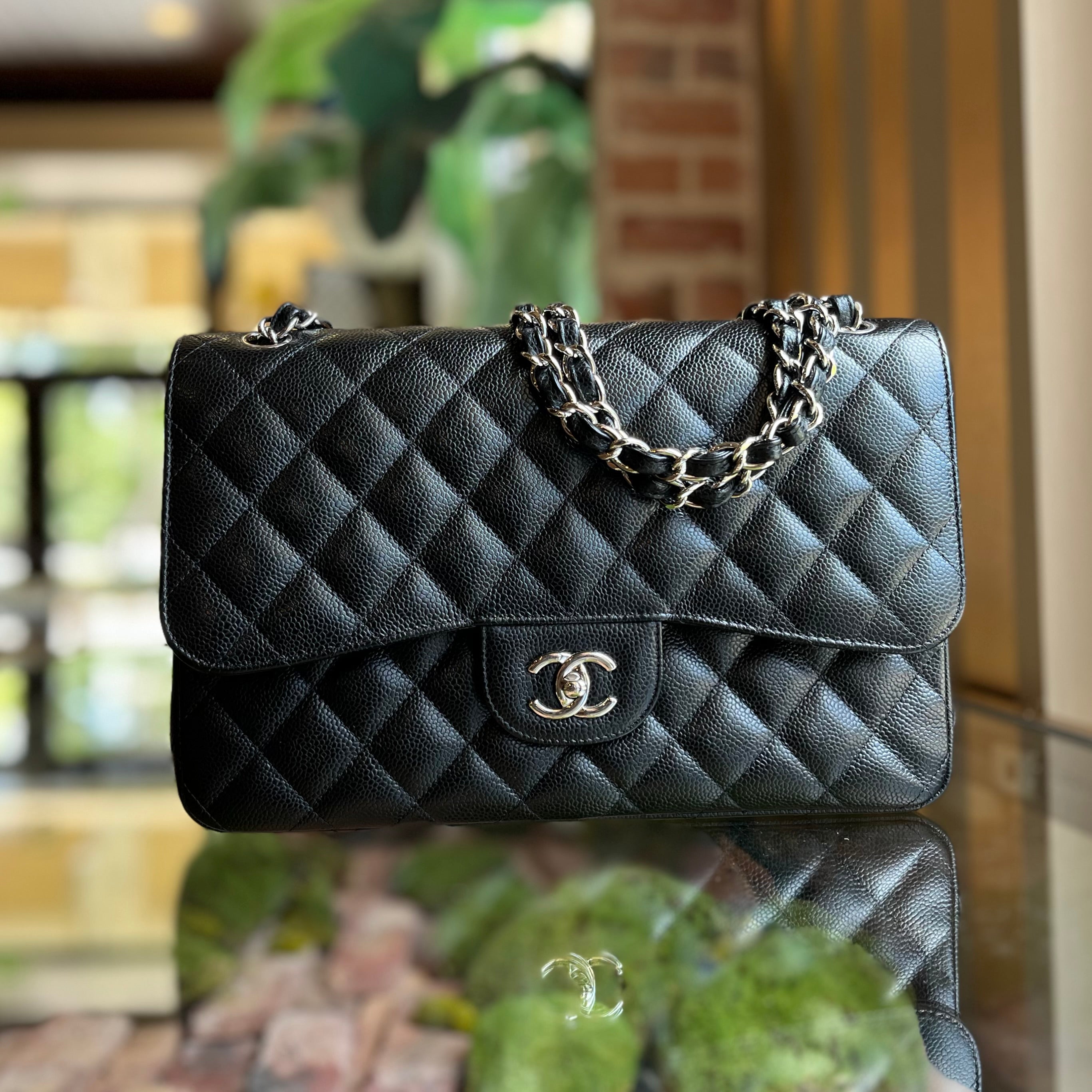 CHANEL Jumbo Double Flap Black Caviar Quilted Leather Shoulder Bag
