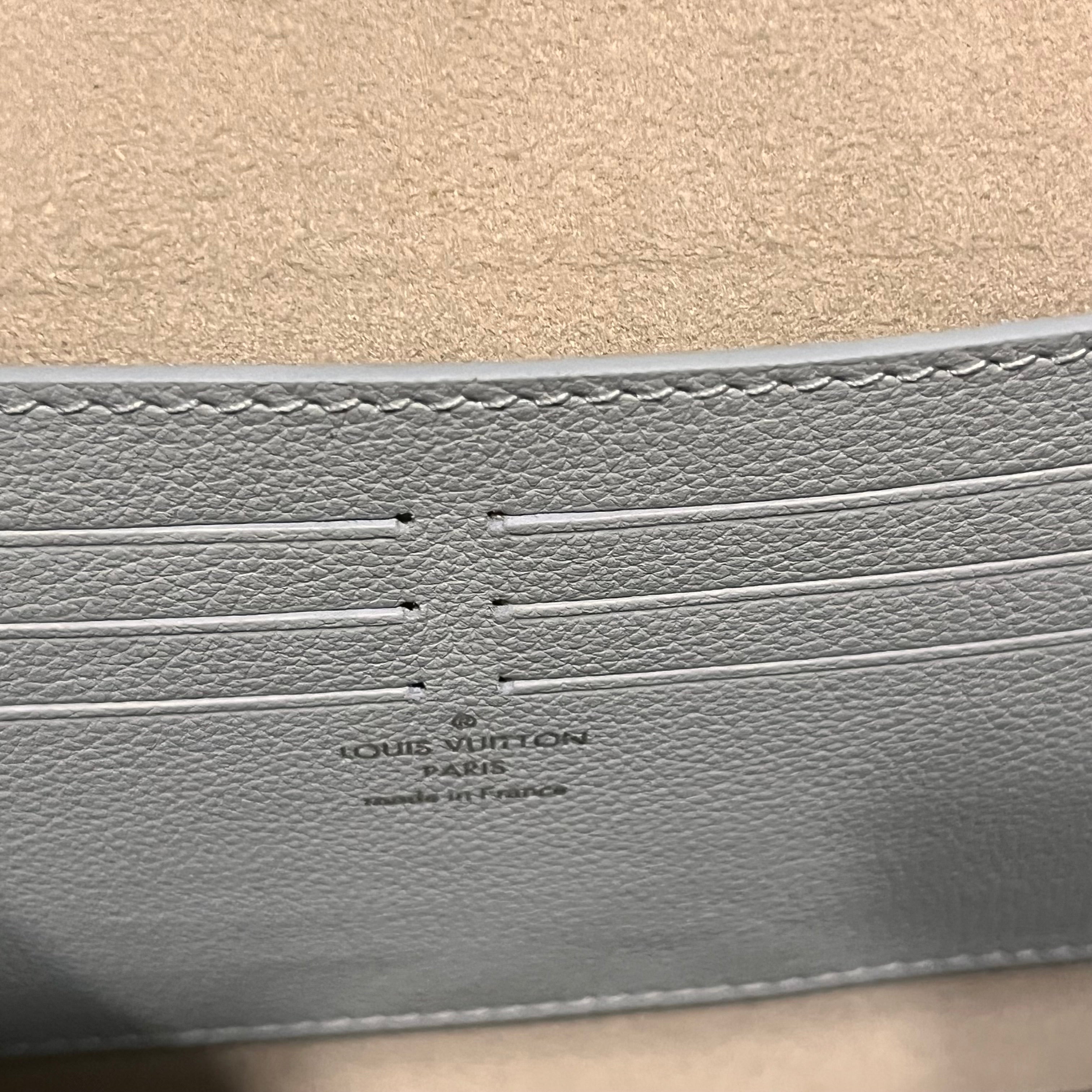 LOUIS VUITTON Lockme Clutch Light Blue Grained Calfskin Leather Shoulder Bag