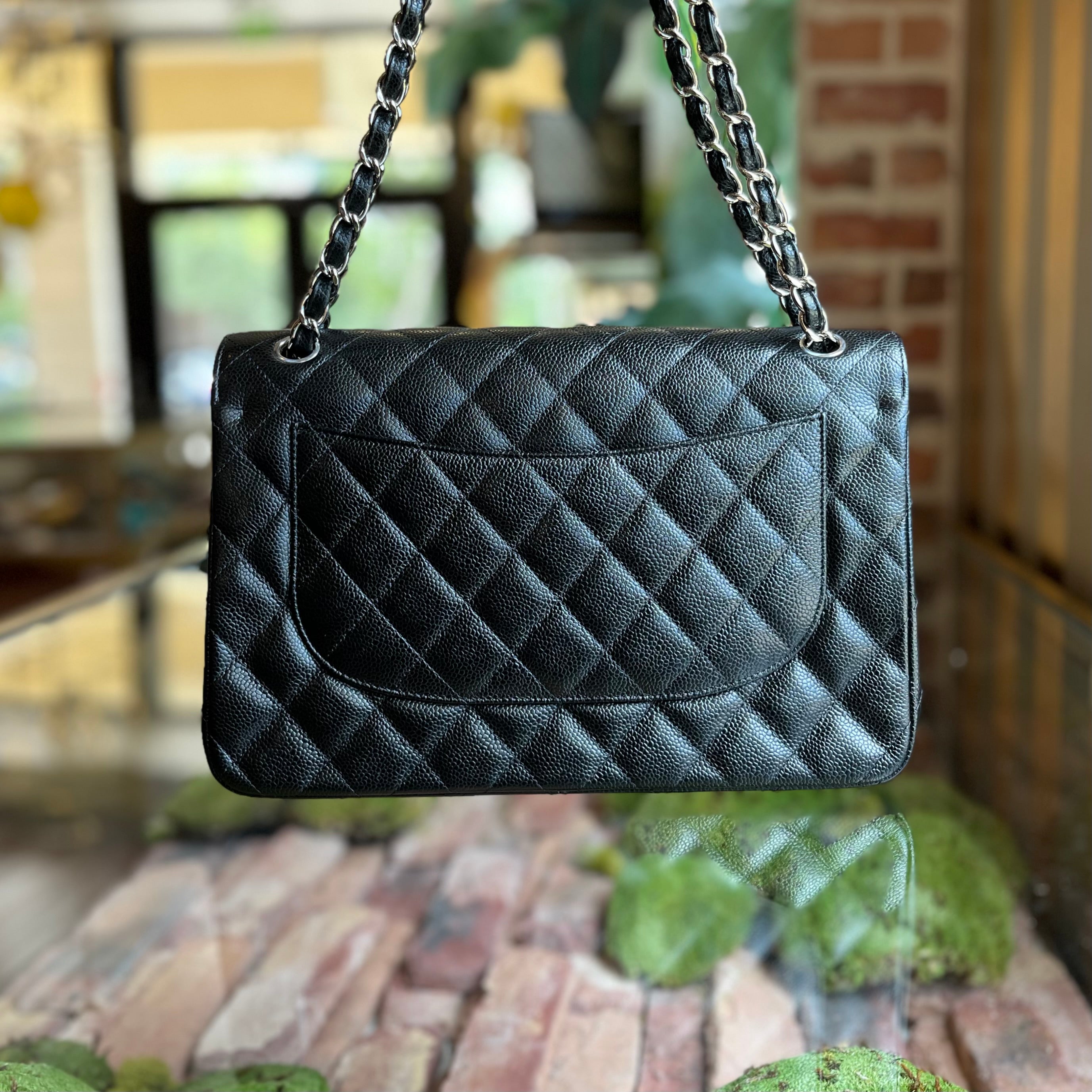 CHANEL Jumbo Double Flap Black Caviar Quilted Leather Shoulder Bag