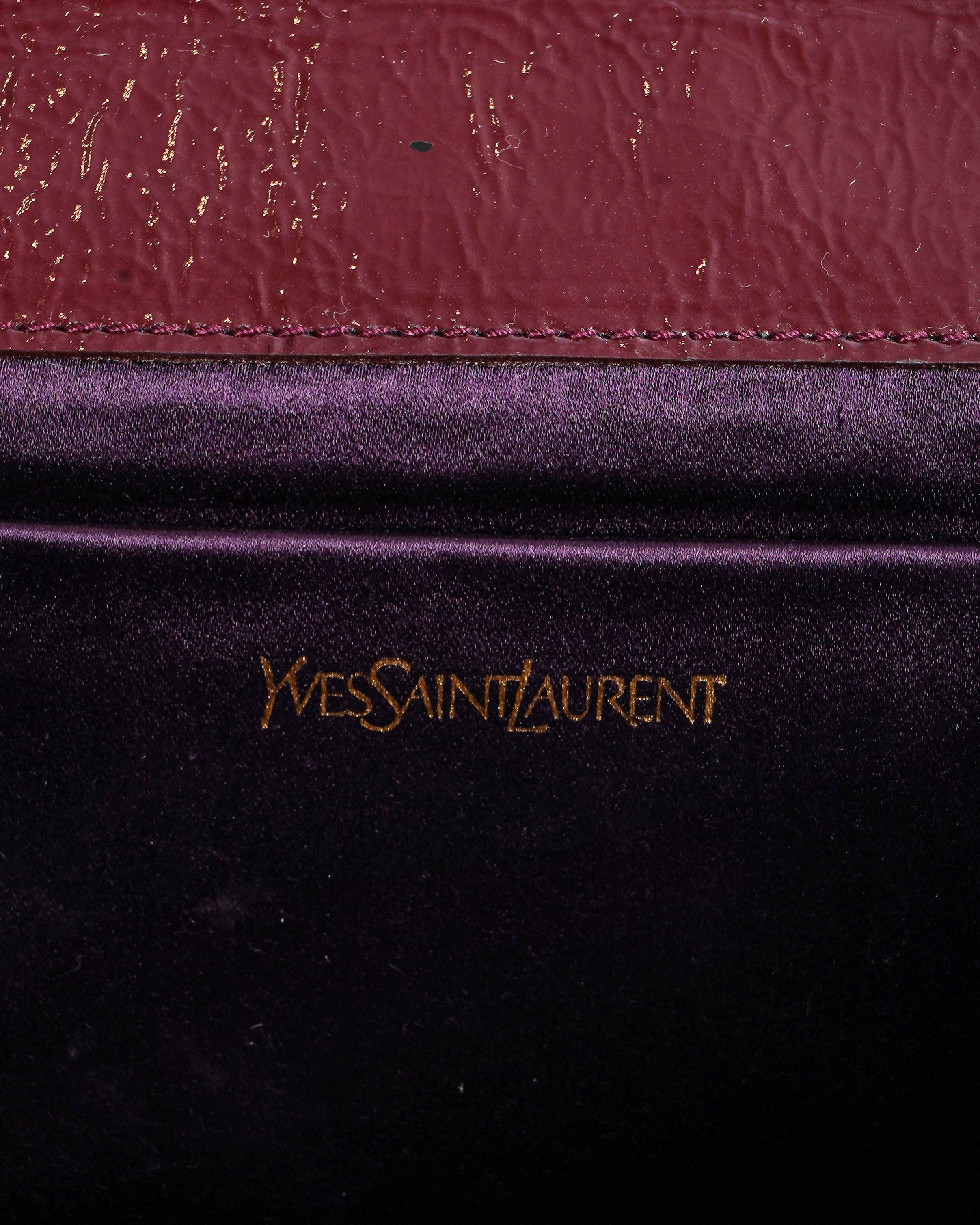Yves Saint Laurent aged leather clutch In burgundy