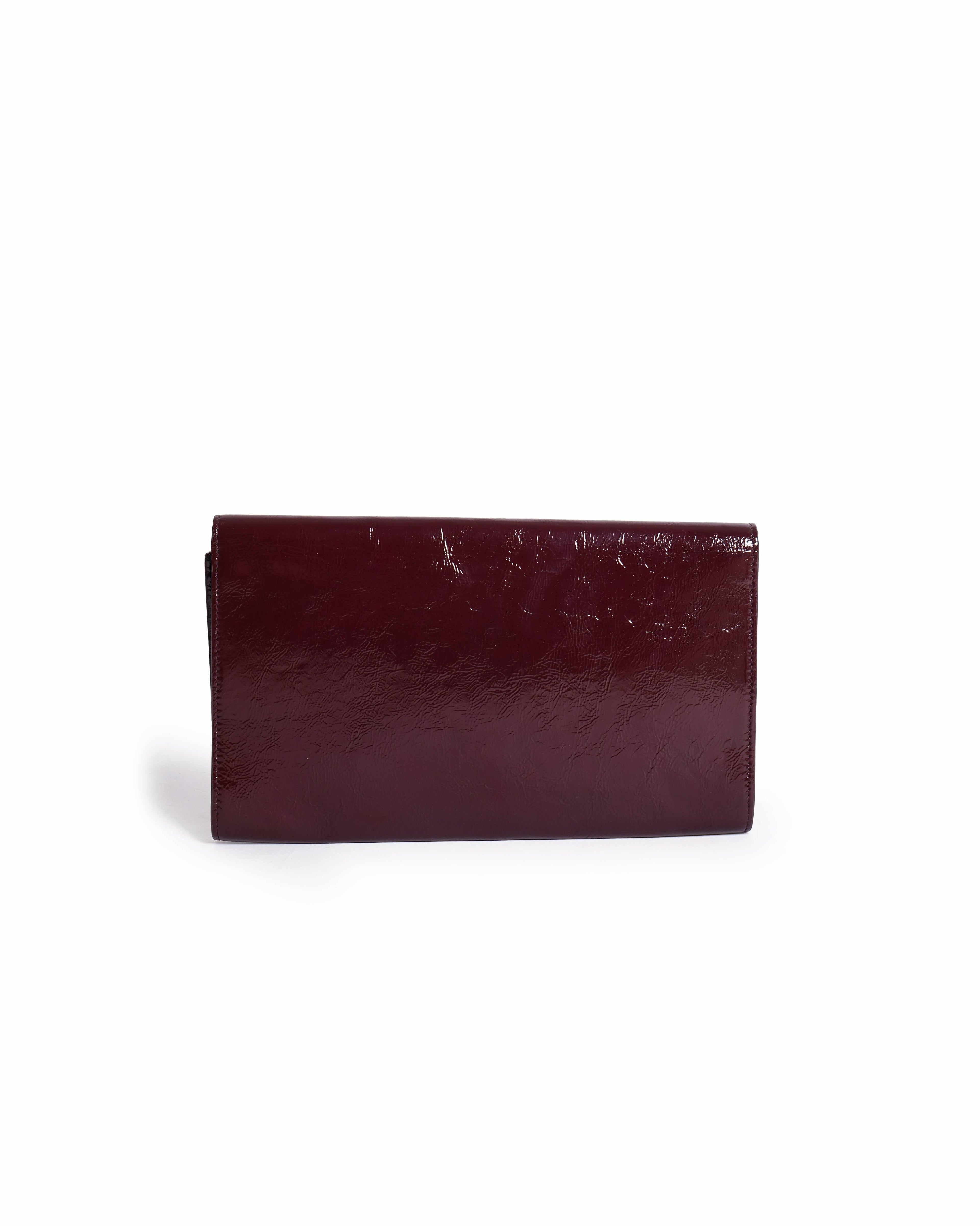 Yves Saint Laurent aged leather clutch In burgundy