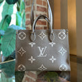 LOUIS VUITTON OnTheGo MM Bicolor Empreinte Giant Monogram Tote Bag