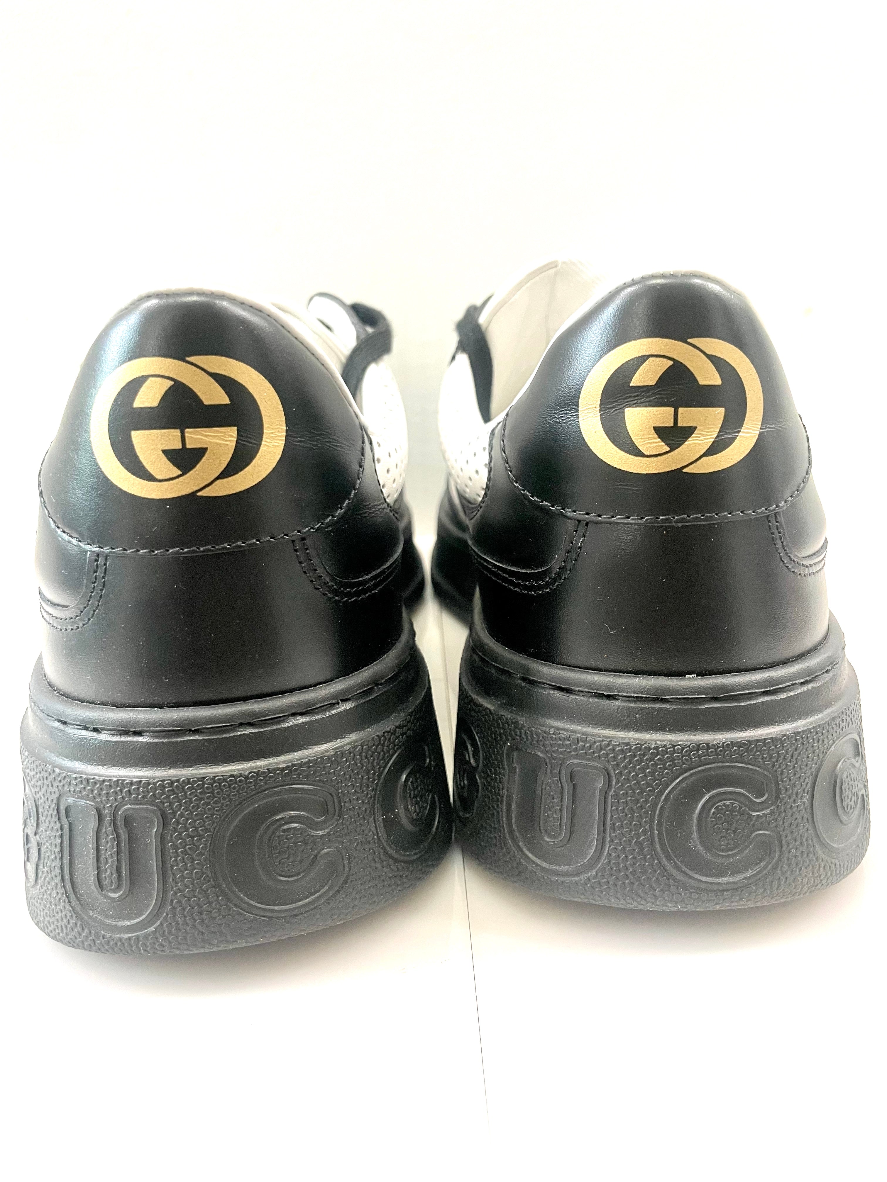 GUCCI GG EMBOSSED LOW-TOP LEATHER SNEAKERS
