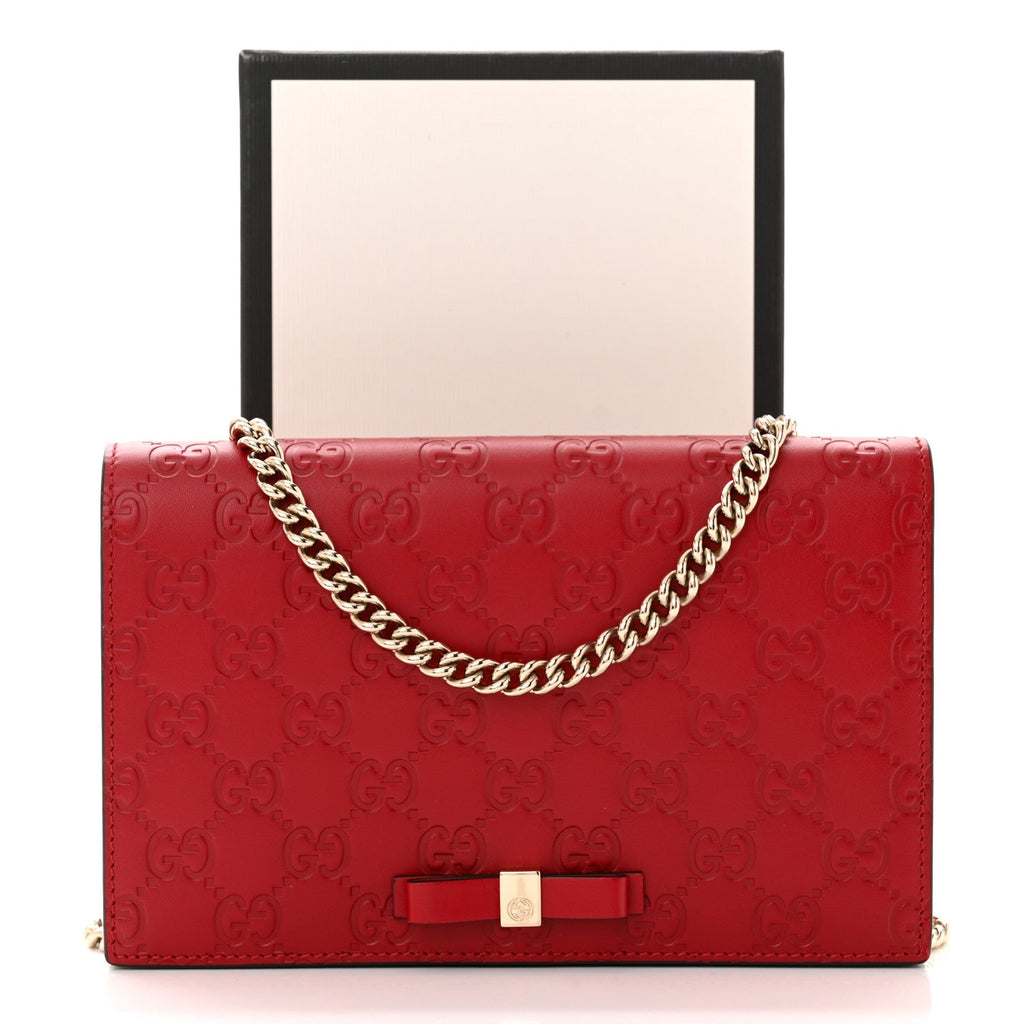 GUCCI GUCCISSIMA LEATHER SIGNATURE BOW WALLET ON CHAIN