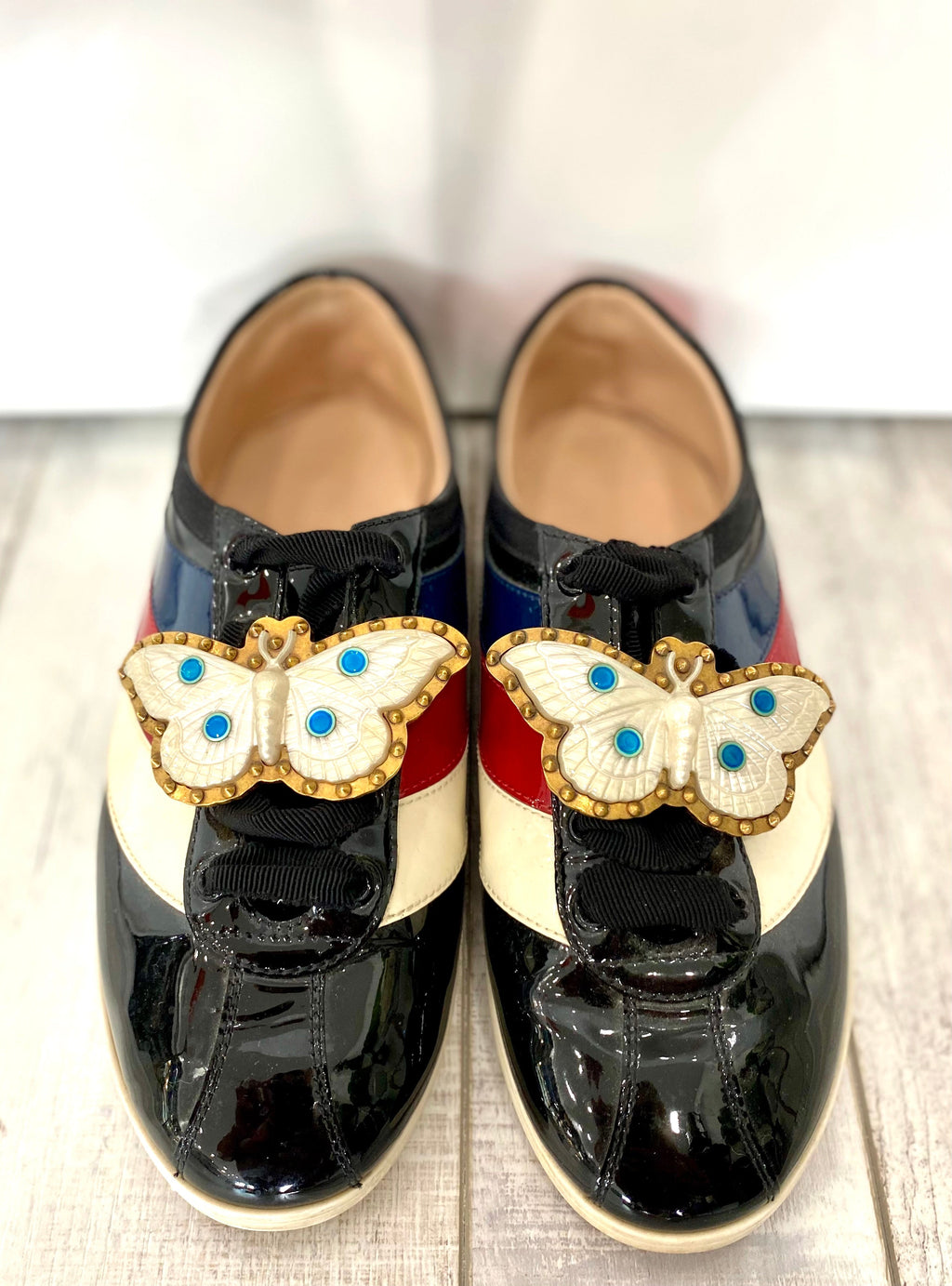 GUCCI PATENT CALFSKIN WEB FALACER BUTTERFLY SNEAKERS
