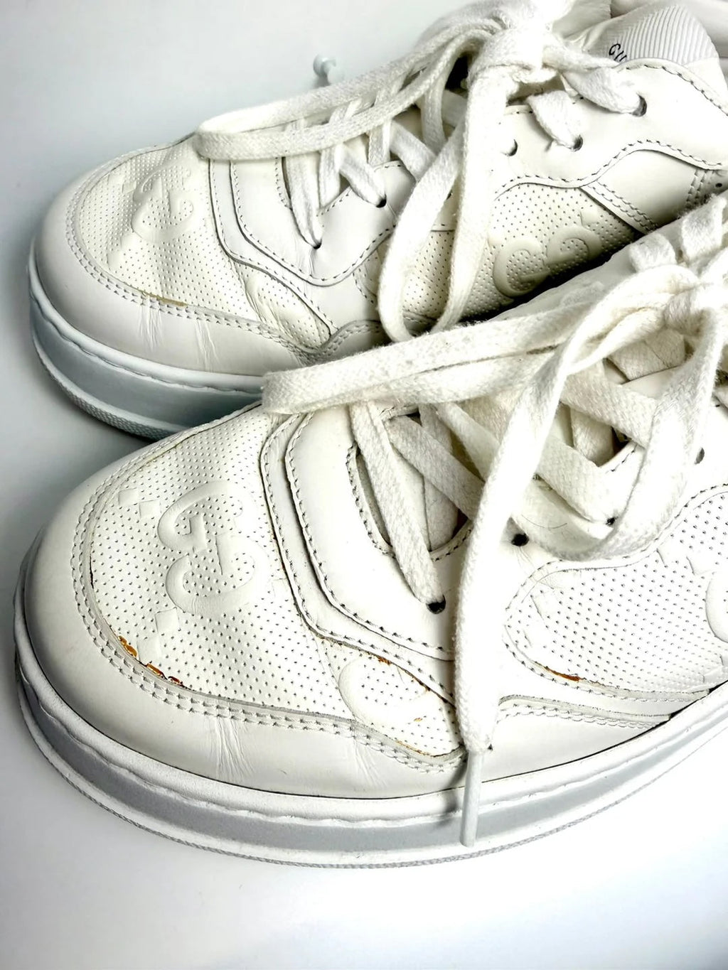 GUCCI GG EMBOSSED LEATHER MEN'S SNEAKERS