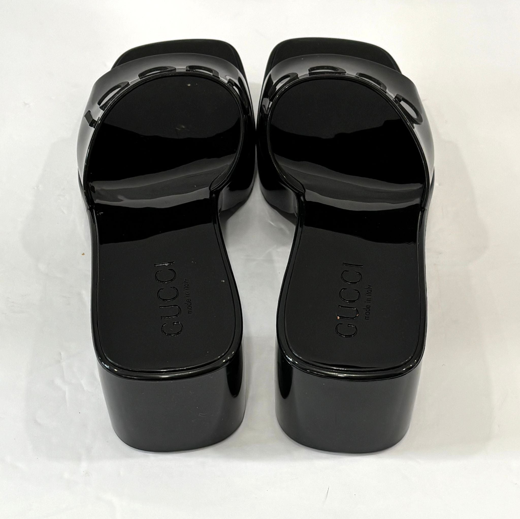 GUCCI EMBOSSED LOGO RUBBER PLATFORM SANDALS