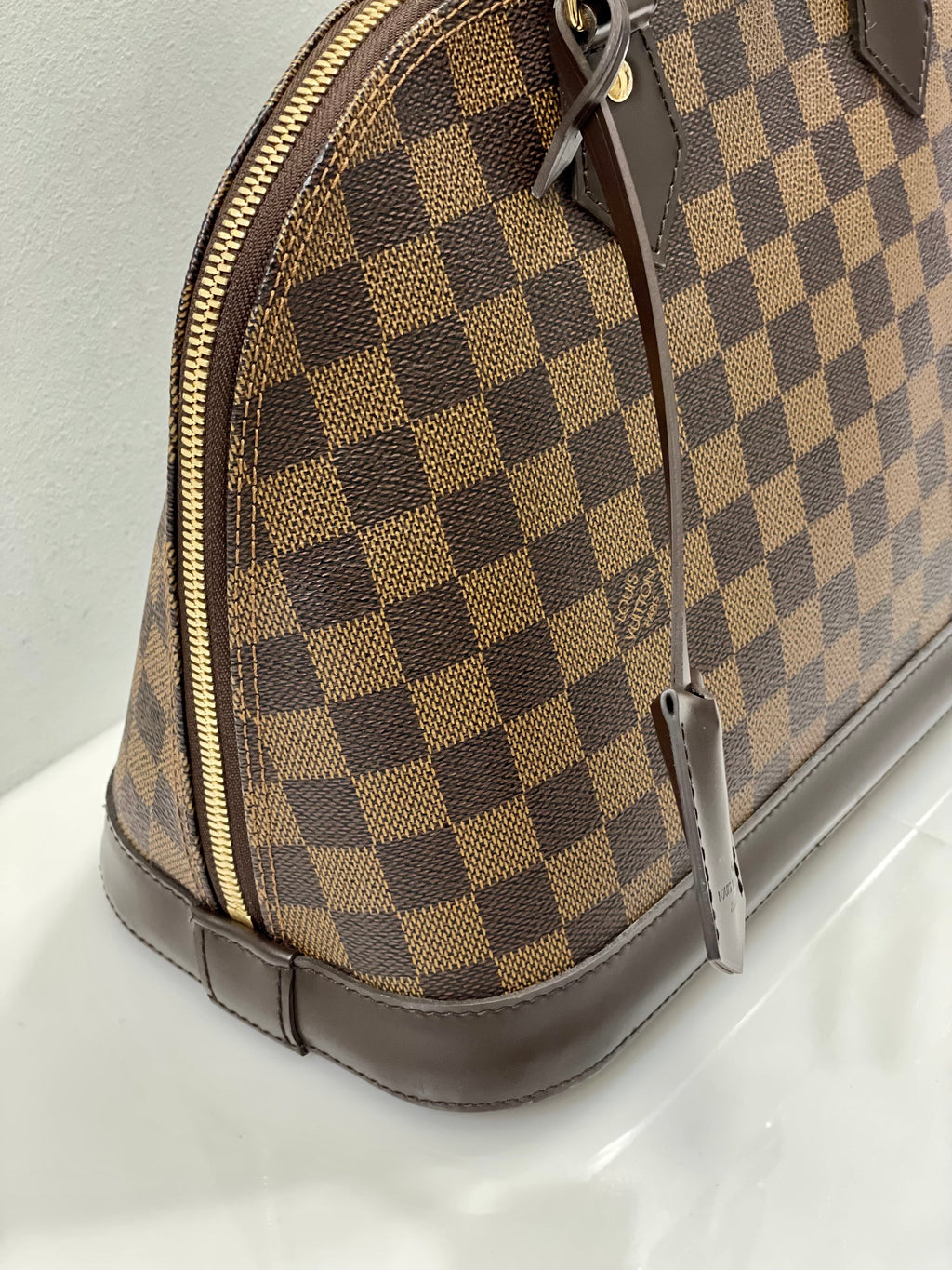 LOUIS VUITTON DAMIER EBENE ALMA PM HANDBAG