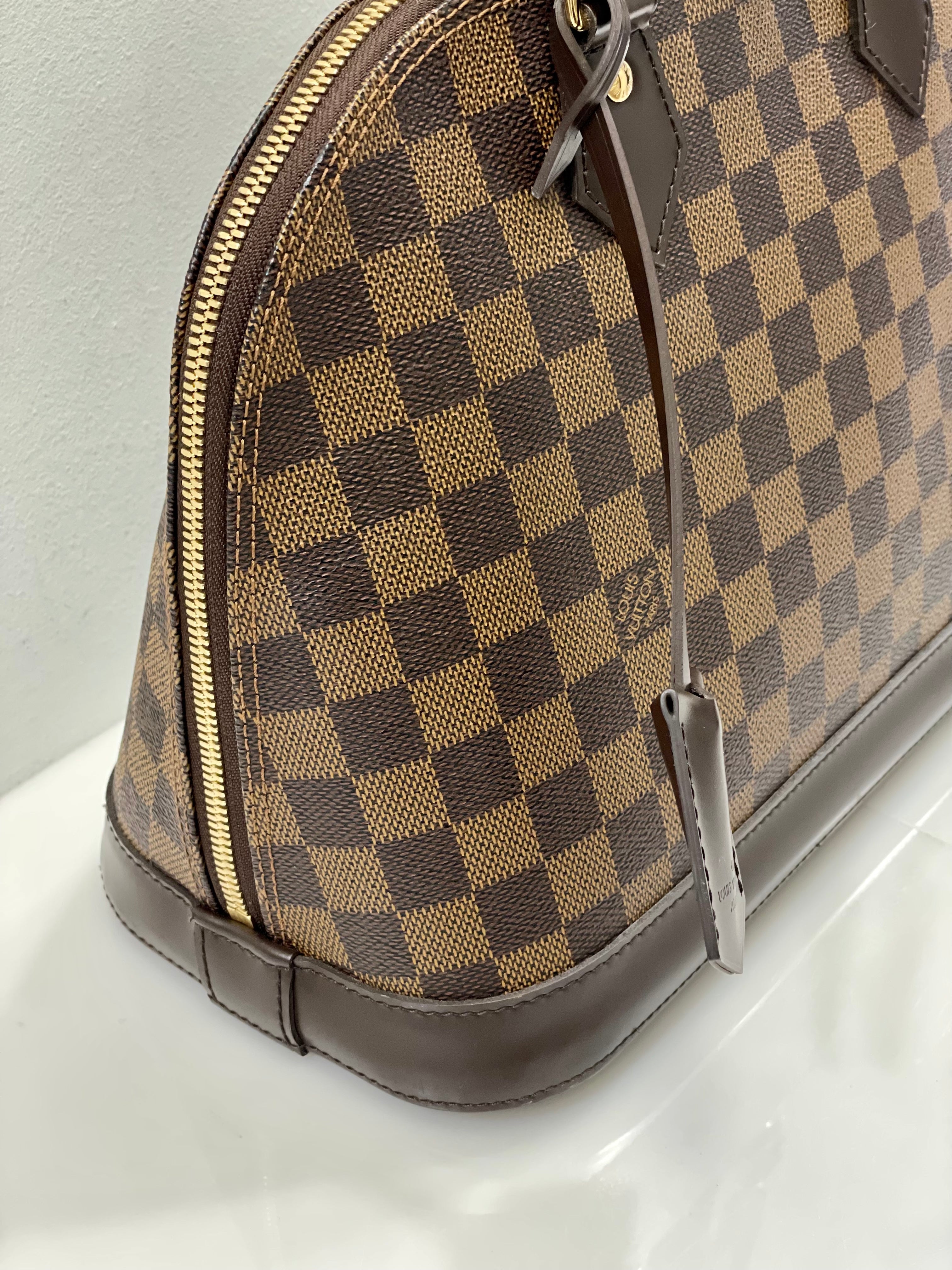 LOUIS VUITTON DAMIER EBENE ALMA PM HANDBAG