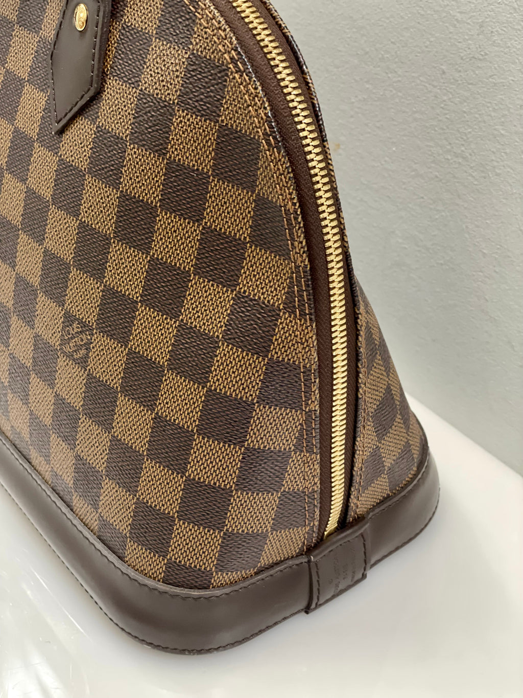 LOUIS VUITTON DAMIER EBENE ALMA PM HANDBAG