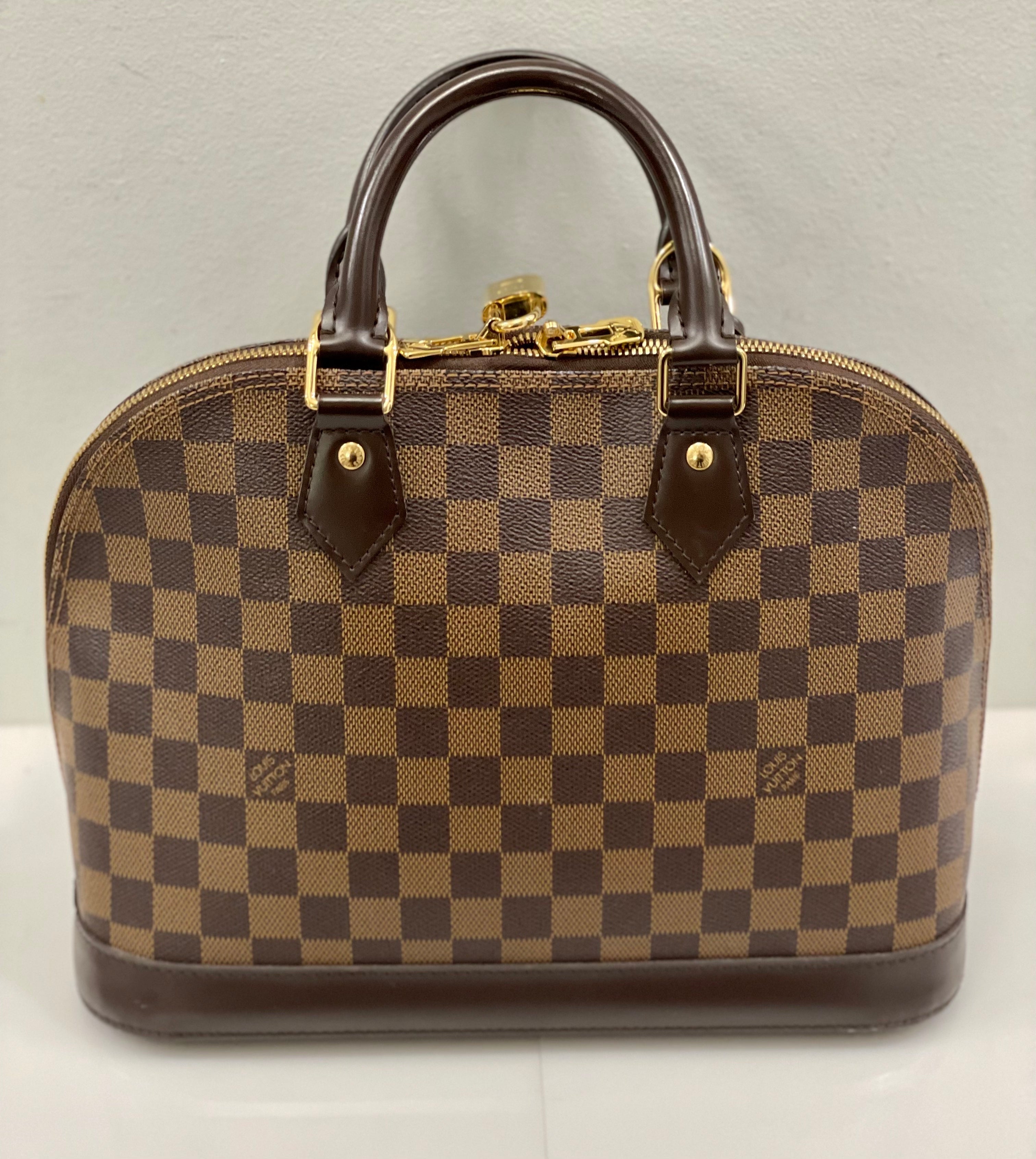 LOUIS VUITTON DAMIER EBENE ALMA PM HANDBAG