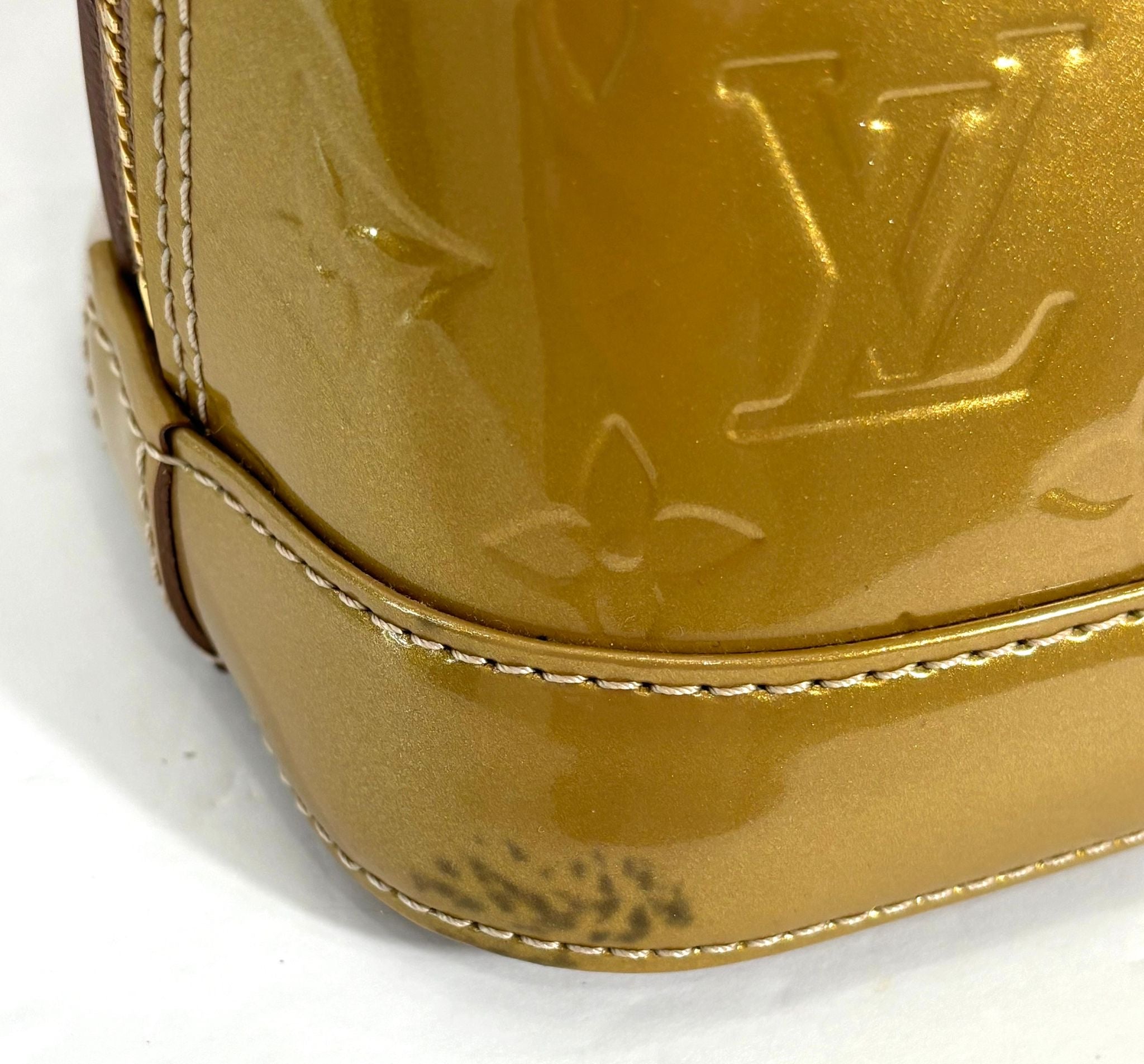 LOUIS VUITTON VERNIS ALMA BB HANDBAG GOLD