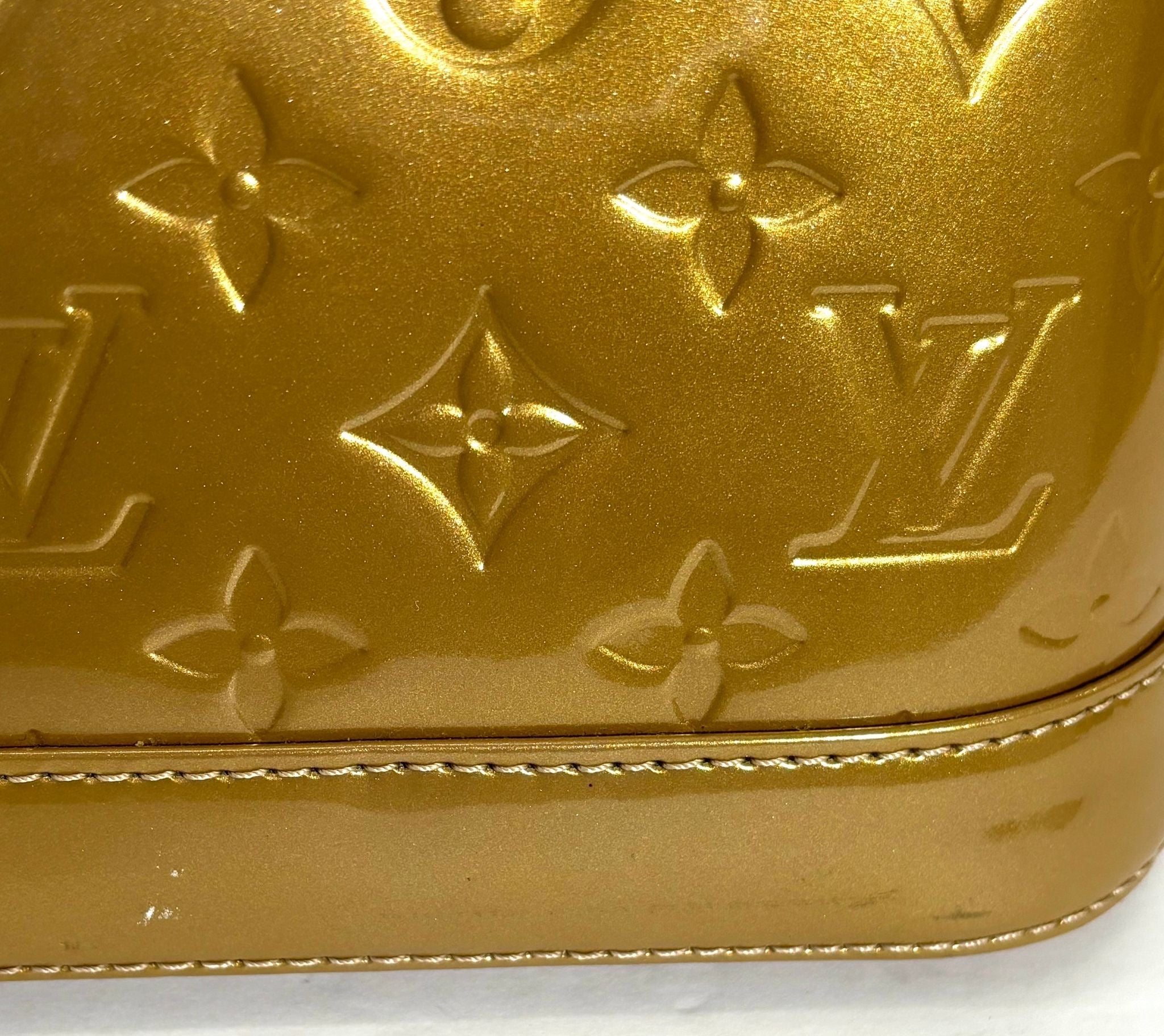 LOUIS VUITTON VERNIS ALMA BB HANDBAG GOLD