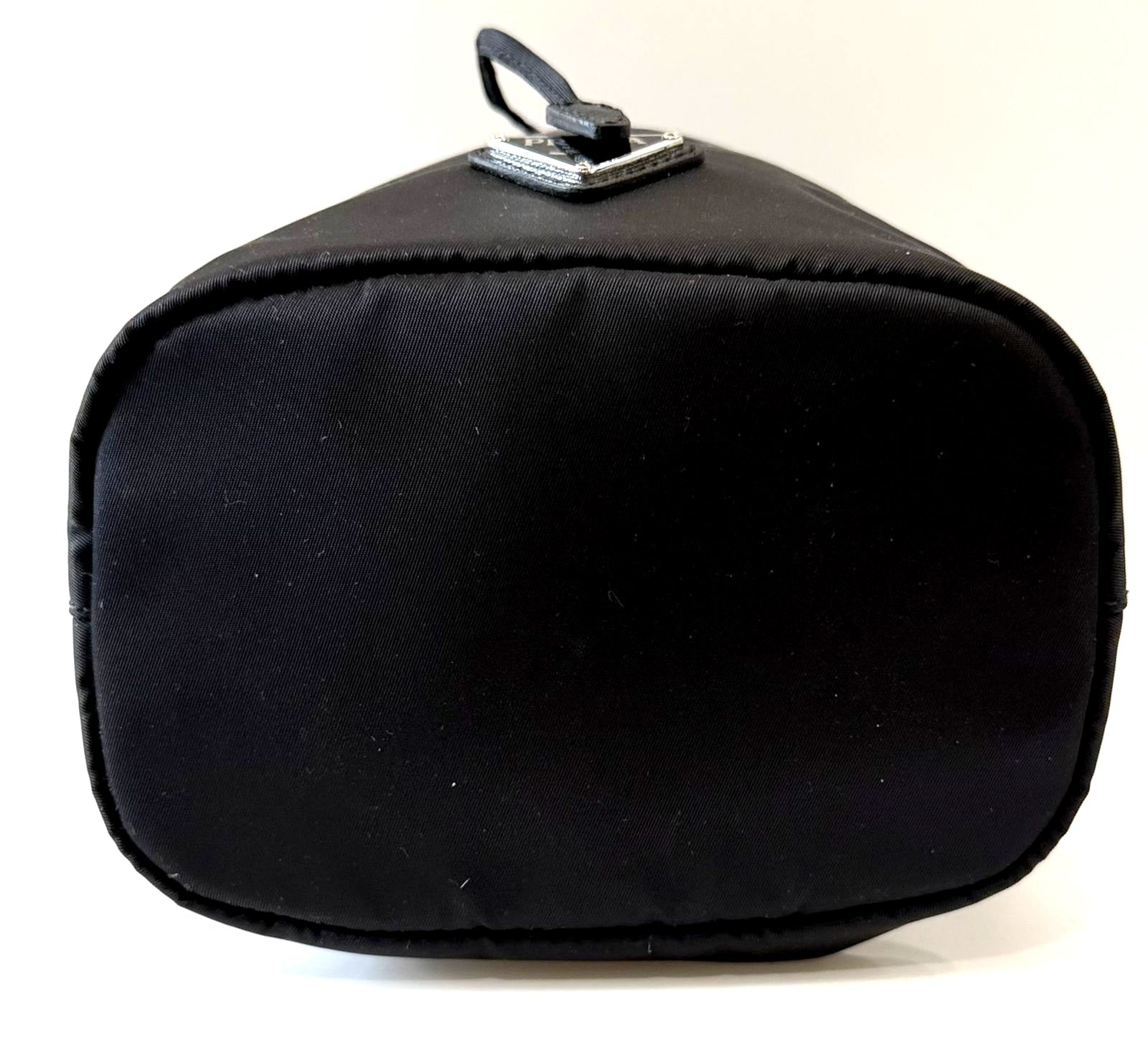 PRADA RE-NYLON TRIANGLE LOGO PLAQUE BUCKET POUCH WRISTLET