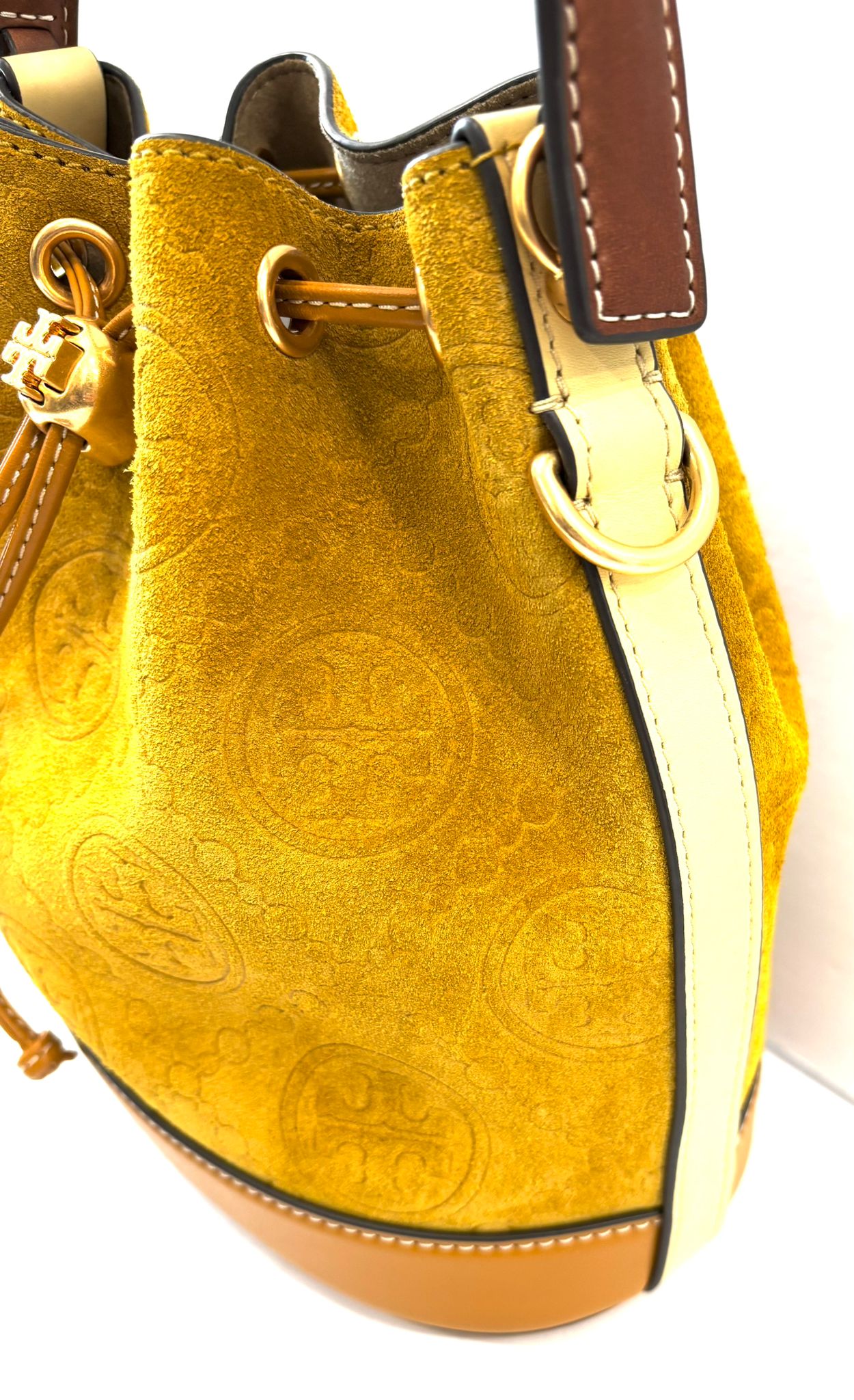 TORY BURCH MONOGRAM EMBOSSED SUEDE BUCKET BAG