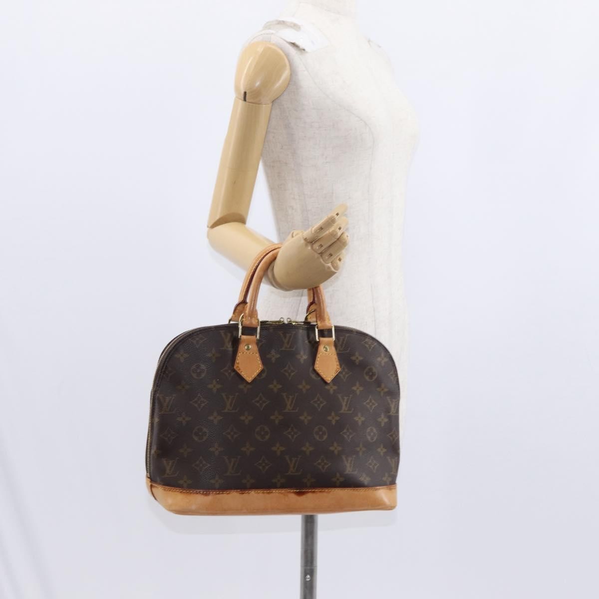 Louis Vuitton Alma Handbag Monogram Canvas Brown Canvas Handbag (Pre-Owned)