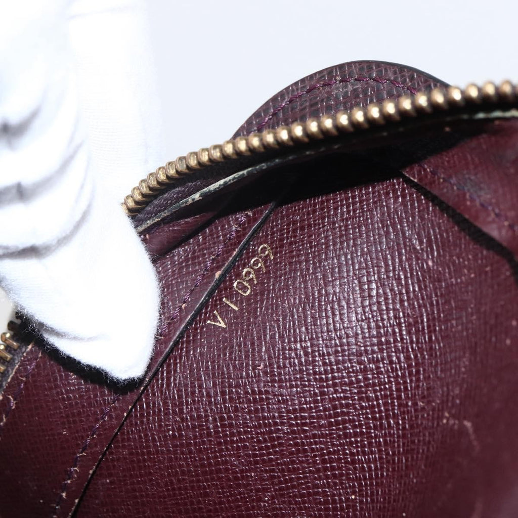 Louis Vuitton Pochette Baikal Clutch Taiga Leather Burgundy Leather Clutche & Pouche Bag (Pre-Owned)
