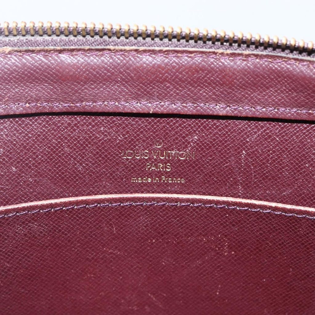 Louis Vuitton Pochette Baikal Clutch Taiga Leather Burgundy Leather Clutche & Pouche Bag (Pre-Owned)
