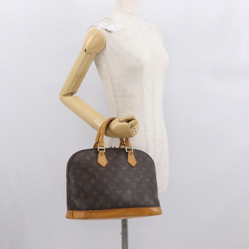 Louis Vuitton Alma Handbag Monogram Canvas Brown Canvas Handbag (Pre-Owned)