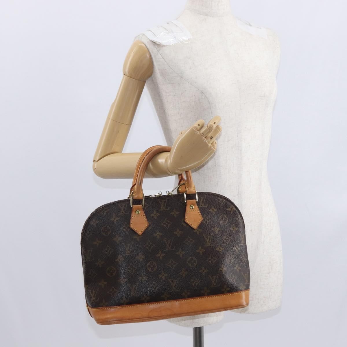 Louis Vuitton Alma Handbag Monogram Canvas Brown Canvas Handbag (Pre-Owned)