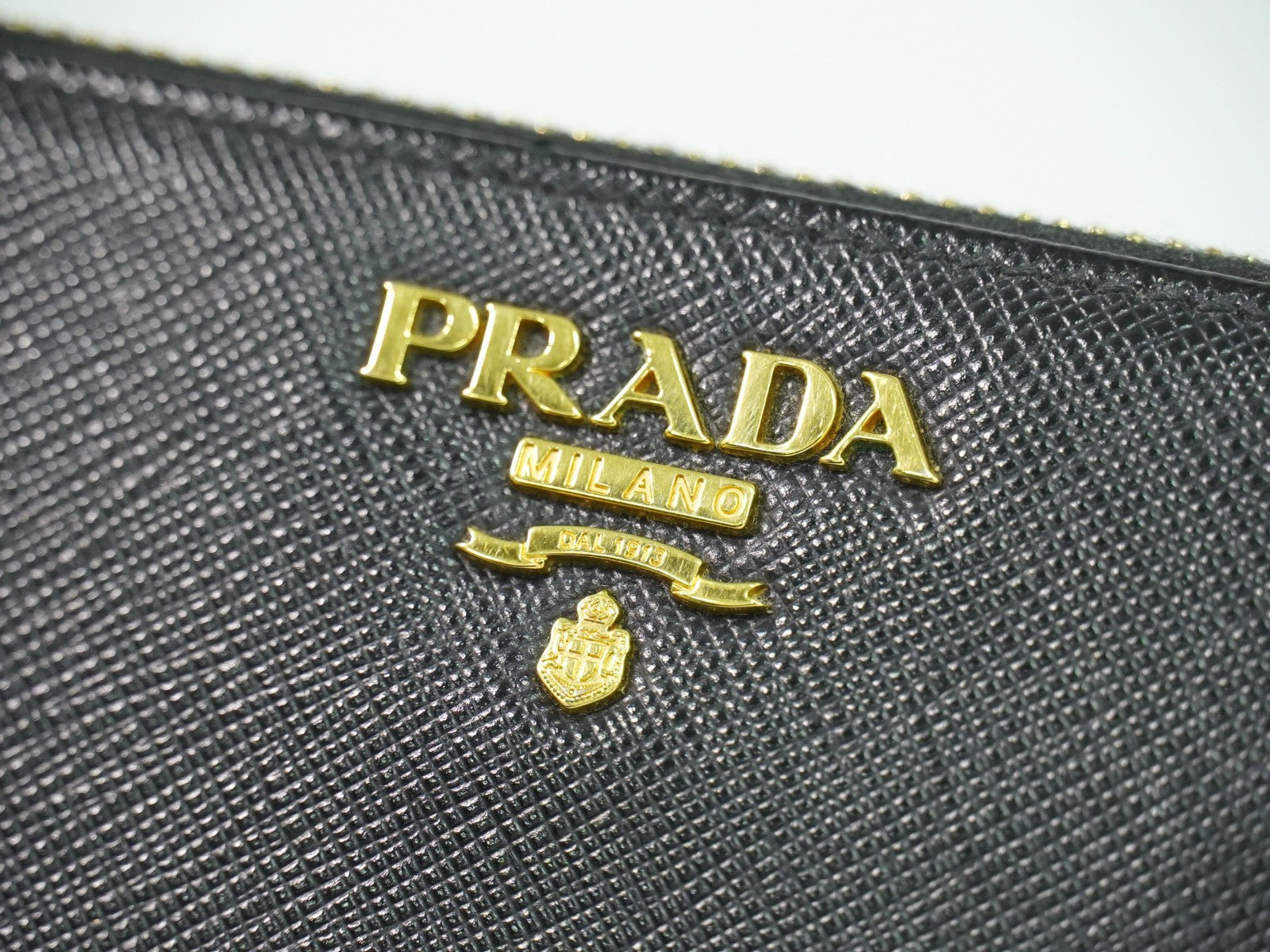 Prada Zip Around Tab Wallet Saffiano Leather Black Leather Wallets Accessory (Pre-Owned)