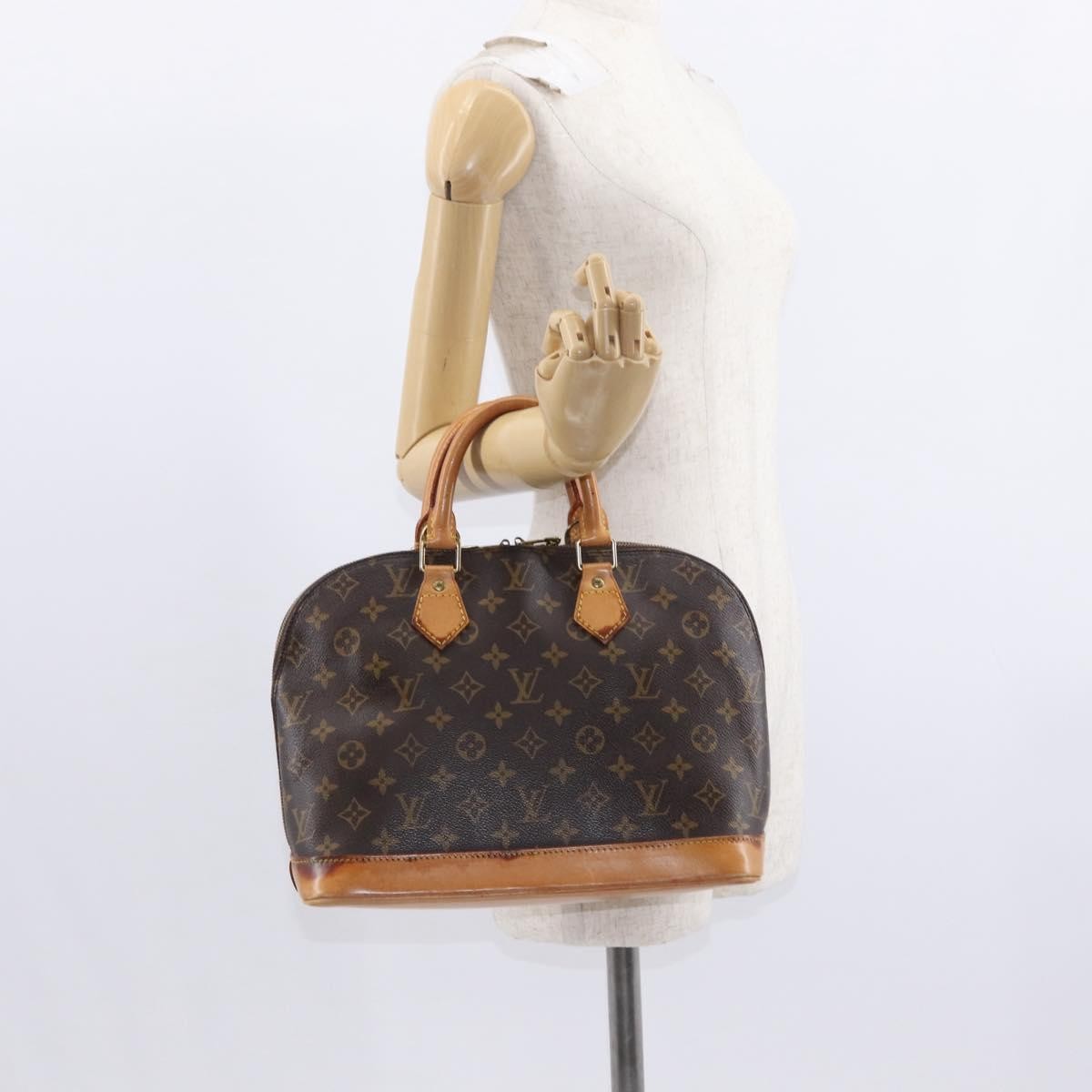 Louis Vuitton Alma Handbag Monogram Canvas Brown Canvas Handbag (Pre-Owned)