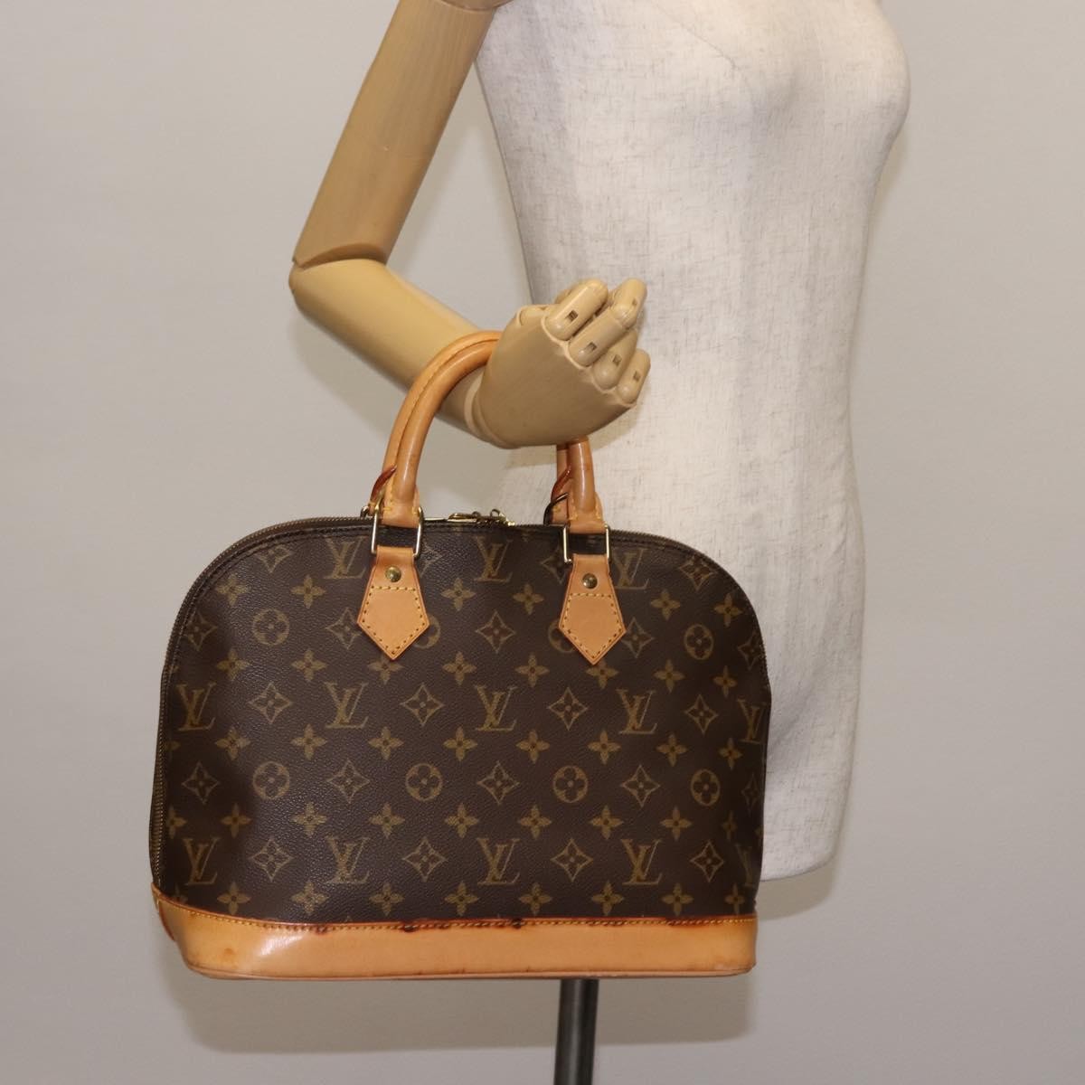 Louis Vuitton Alma Handbag Monogram Canvas Brown Canvas Handbag (Pre-Owned)