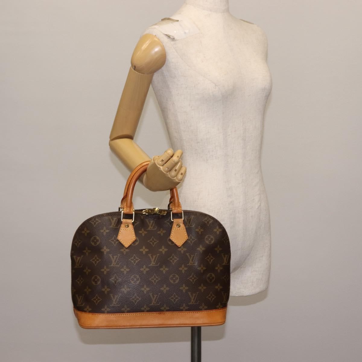 Louis Vuitton Alma Handbag Monogram Canvas Brown Canvas Handbag (Pre-Owned)