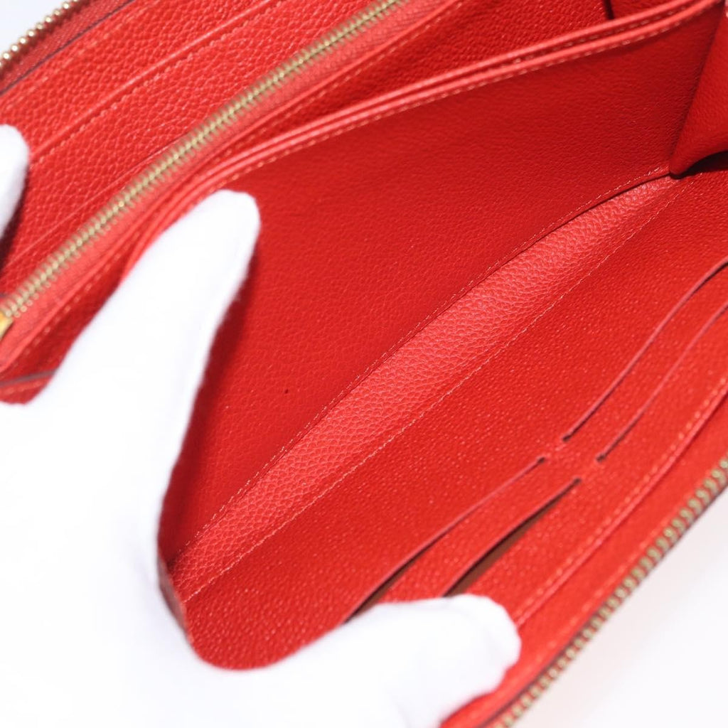 Louis Vuitton Portefeuille Zippy Monogramme Empreinte Monogramme Empreinte Orange Leather Wallets Accessory (Pre-Owned)