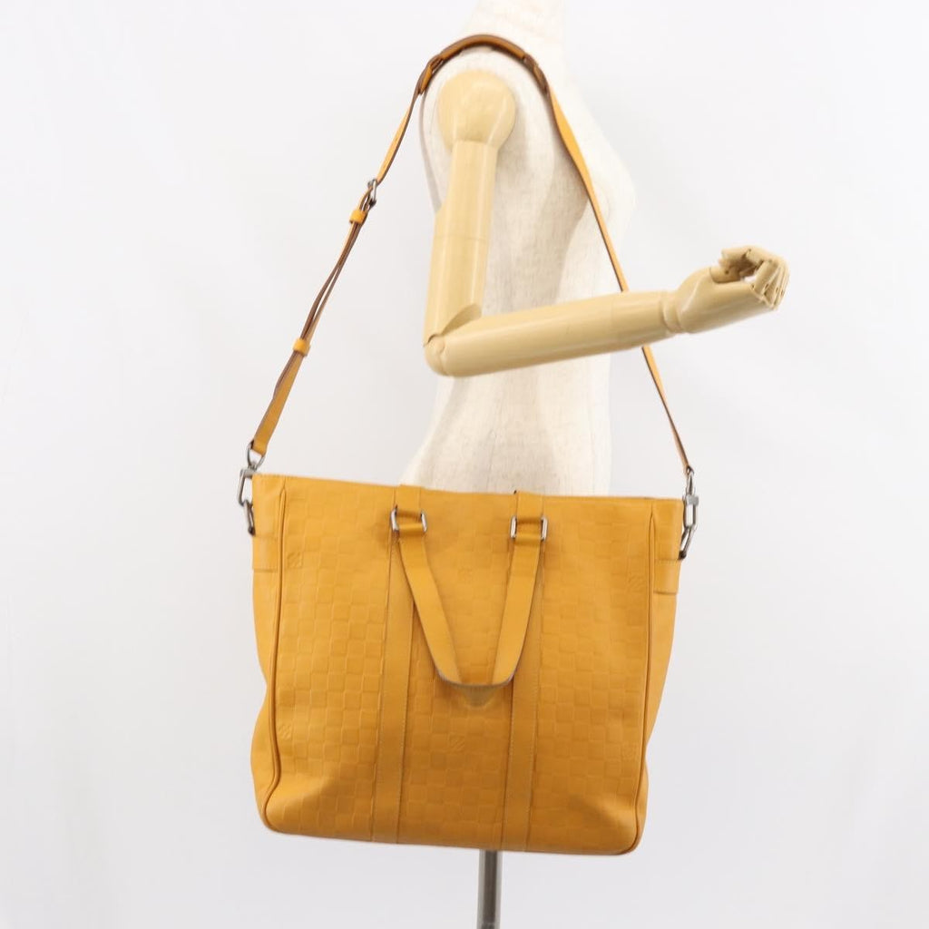 Louis Vuitton Tadao Handbag Damier Infini Leather Yellow Leather Handbag (Pre-Owned)