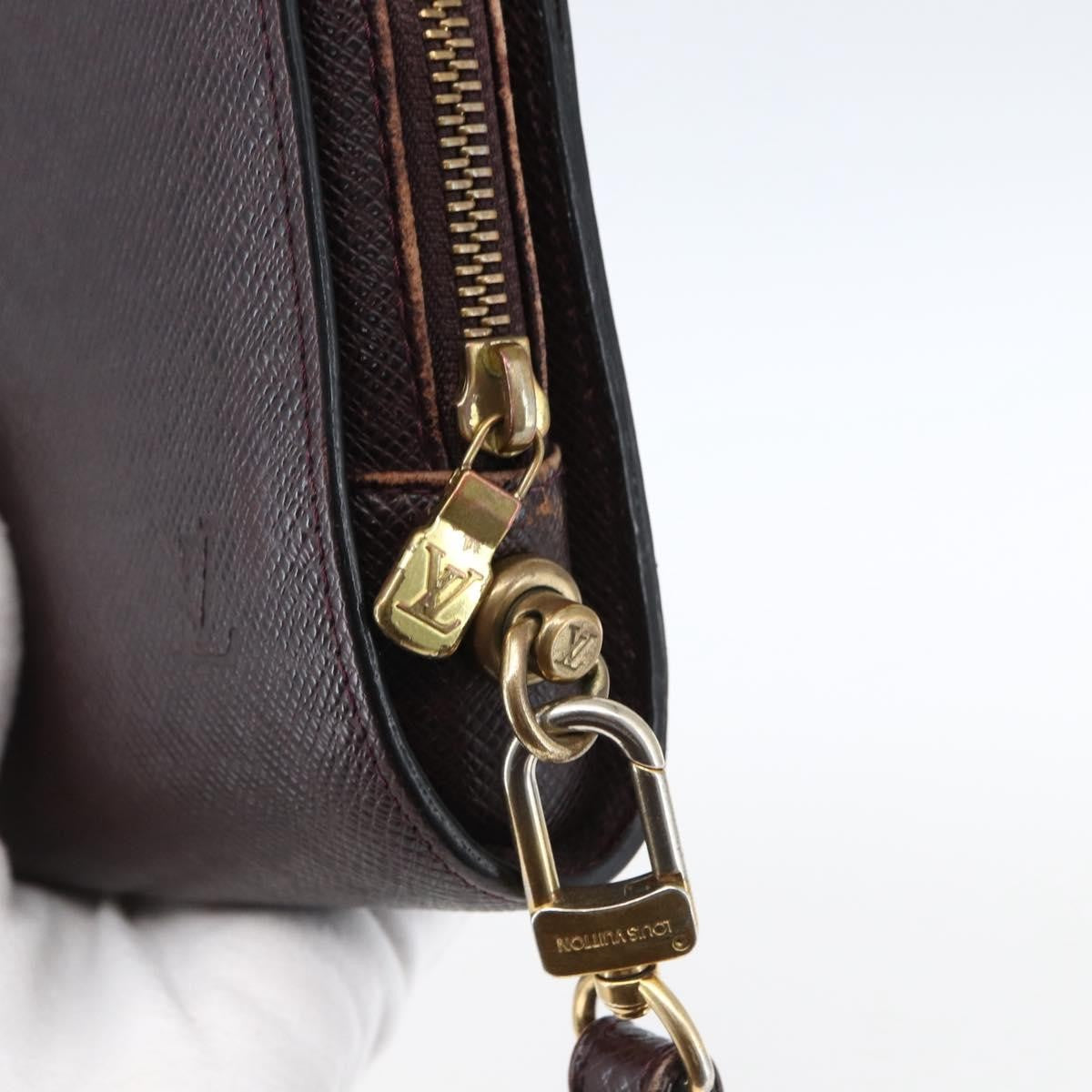 Louis Vuitton Pochette Baikal Clutch Taiga Leather Burgundy Leather Clutche & Pouche Bag (Pre-Owned)