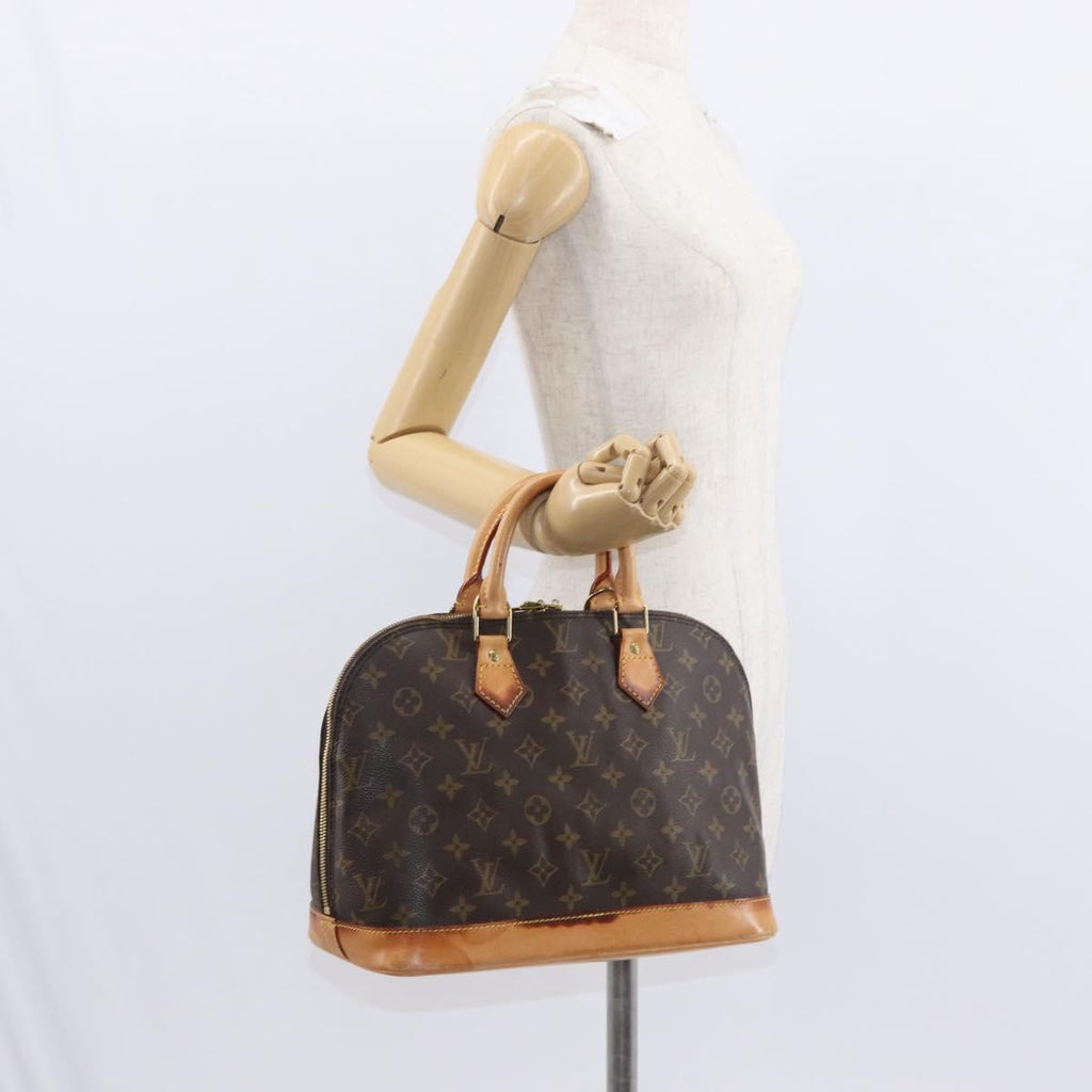 Louis Vuitton Alma Handbag Monogram Canvas Brown Canvas Handbag (Pre-Owned)