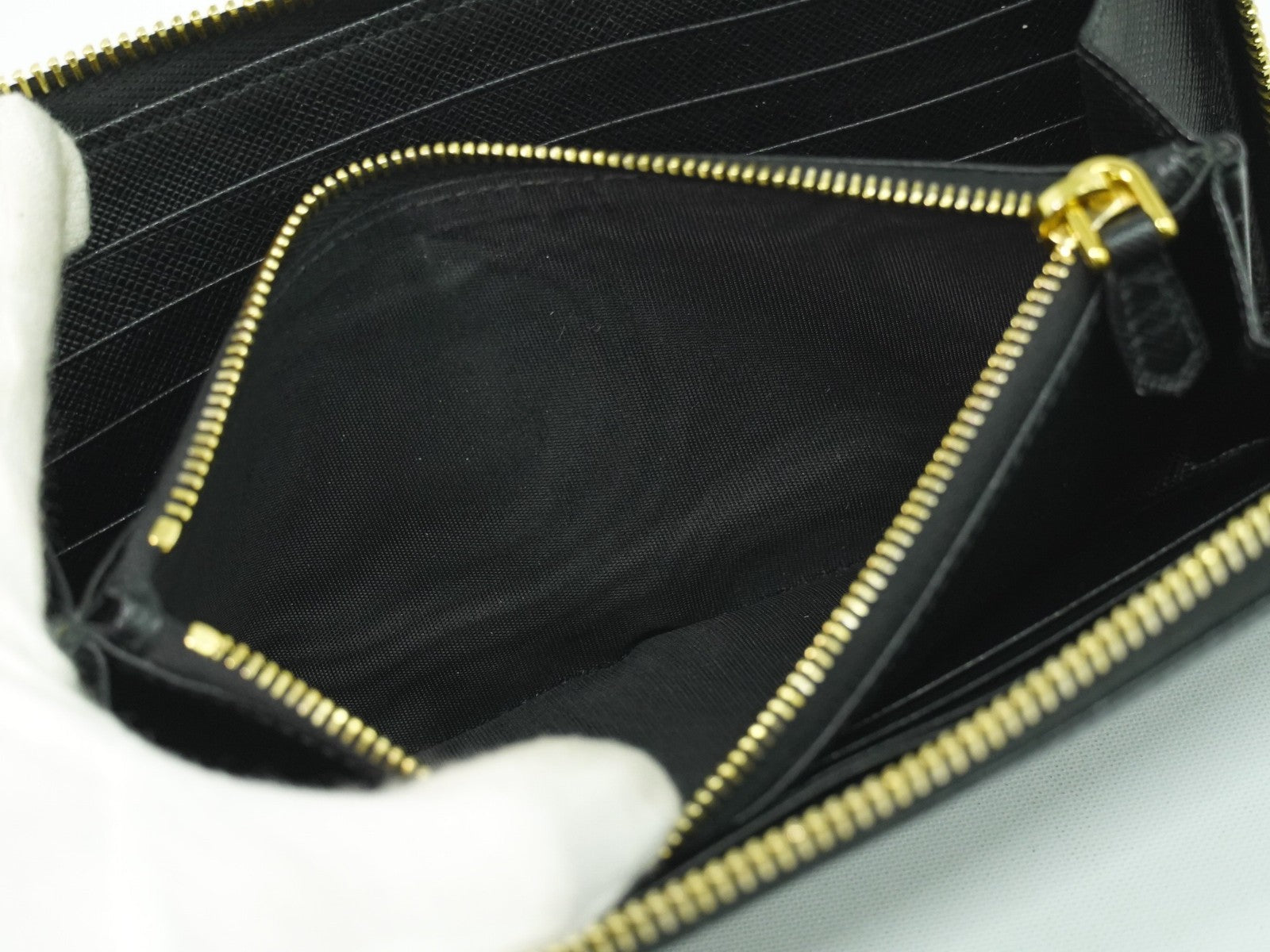 Prada Zip Around Tab Wallet Saffiano Leather Black Leather Wallets Accessory (Pre-Owned)